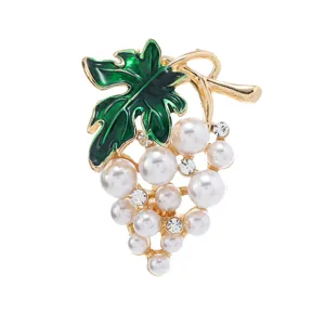 Cute grape brooch featuring green enamel leaf, pearls and rhinestones for stylish sweater wear.