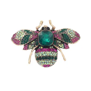 Broche abeille en cristal avec strass colores et pierre centrale verte pour mode femme.