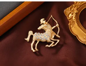Matte gold centaur brooch for women, creative rhinestone animal clothing accessory pin.