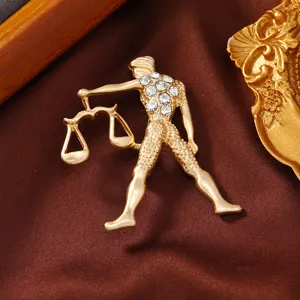 Gold-plated Libra zodiac brooch featuring sparkling rhinestones, elegant clothing accessory.