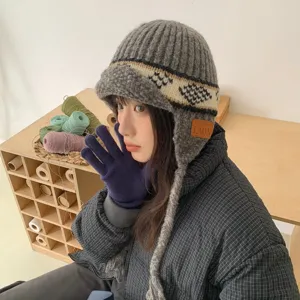 Fair Isle knitted ear-flap bomber hat for women, winter warm jacquard beanie with brim.