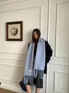 Chic winter wool blend scarf for women, cozy warm tassel shawl in light blue hue.
