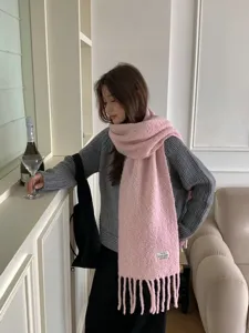 Cozy pink textured wool blend scarf with fringe for women, perfect winter warm fashion accessory.