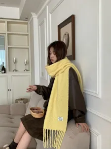 Chic yellow wool blend tassel scarf for women, cozy winter warm fashion accessory.
