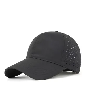 Detailed view of black quick-dry baseball cap with side laser-cut breathable holes and brim.