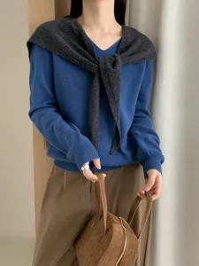Cozy wool V-neck sweater with chic draped shawl scarf detail, perfect autumn women apparel.