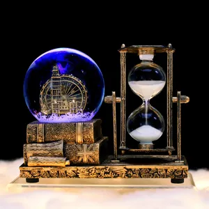 Vintage glowing snow globe hourglass desk ornament with music box function for office decor.