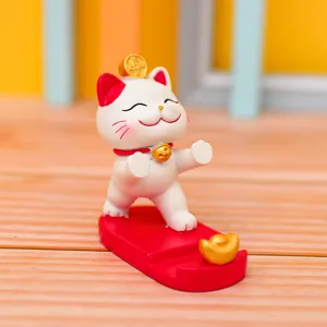 Cute lucky cat desk phone holder, cartoon resin ornament for office and home decoration.