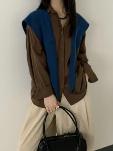 Stylish pure wool knitted button shawl for women, elegant draped outerwear and scarf detail.