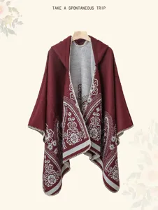 Detailed view of the ethnic style hooded cashmere-feel cloak, featuring intricate paisley patterns.