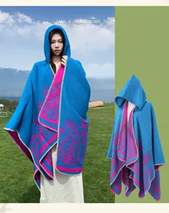 Ethnic style cashmere-feel hooded cape with vibrant paisley print, perfect for cozy outdoor travel.
