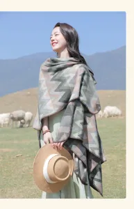Ethnic style geometric chevron cape detail, perfect for travel outfits and cozy photo shoots.
