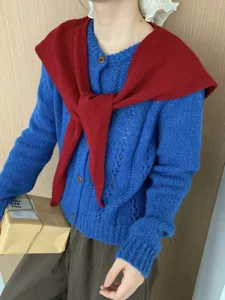 Knitted cardigan with red shawl scarf detail, elegant women wool outerwear style.