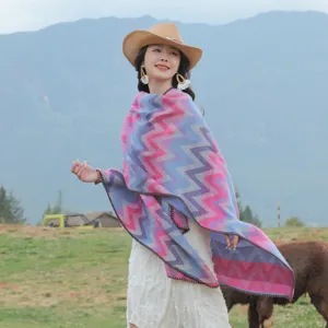 Colorful wave pattern knitted poncho cape shawl for women, perfect for travel and cold weather.