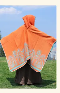 Ethnic hooded cashmere-feel poncho with classic paisley pattern for outdoor travel.
