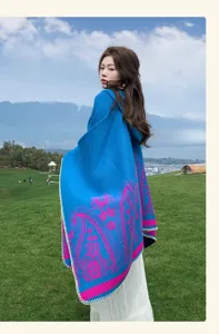 Detailed close-up shot of ethnic paisley cashmere-feel cloak, outdoor warm shawl cape.