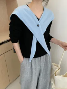 Detail view of the stylish Korean wool cross-button pointed shawl paired with knit top.