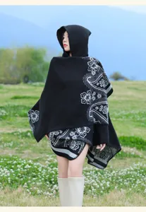 Ethnic style black hooded cashmere-feel paisley poncho cloak detail view showing texture.