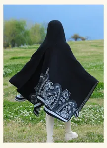 Black hooded poncho cape with ethnic paisley pattern, warm cashmere-feel winter outer wear.