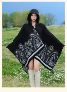 Detailed view of the black ethnic hooded paisley poncho cloak, showing soft texture and pattern.