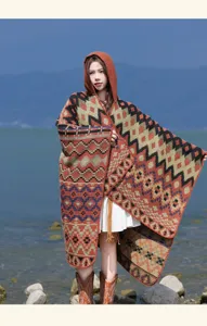 Ethnic colorful geometric hooded shawl, warm knitted cloak for travel and photography outdoor wear.