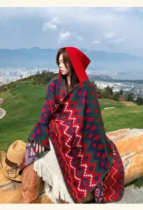 Ethnic style colorful geometric hooded shawl, warm knitted cape for travel and outdoor photos.