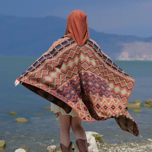 Ethnic colorful geometric hooded knitted shawl cape, perfect for travel and outdoor photoshoots.