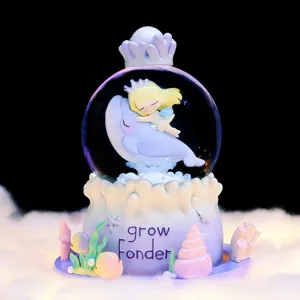 Caja de música bola de nieve ballena océano de ensueño, figura de niña decoración.