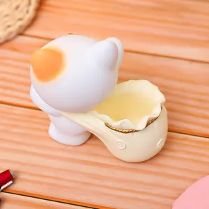 Cute cat piggy bank resin pen holder, creative home decor storage ornament detail.