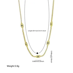 Collier tennis en or avec zircones motif mauvais œil et design chaîne multicouche.