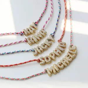 Handmade colorful braided cord necklace featuring custom 3D rhinestone letter pendants.