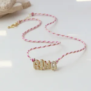 Custom braided cord rhinestone 3D letter RINA pendant necklace detail closeup shot for gifts