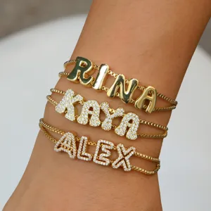 Customized 18k gold plated letter name bracelets featuring sparkling pave rhinestones and smooth finish.