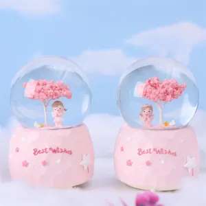 Pink crystal snow globe with angel and cherry blossom tree, romantic gift home decor.
