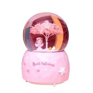 Pink snow globe night light with cherry blossom tree and angel girl, romantic desktop decoration gift.