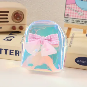 Holographic mini backpack coin purse with cute pink bow, portable keyring earphone storage bag.