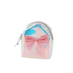 Close-up detail of the holographic mini backpack coin purse featuring a pink bow and zipper.