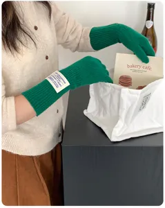 Women's long green knitted gloves autumn and winter warm solid color arm warmers stylish design.