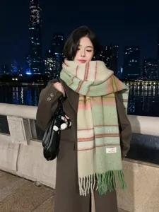 Chic color-blocked gradient winter scarf for women, featuring cozy tassel details and warm cashmere.