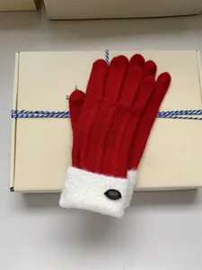 Red winter knitted gloves with plush white cuff and gift box for warm daily wear.