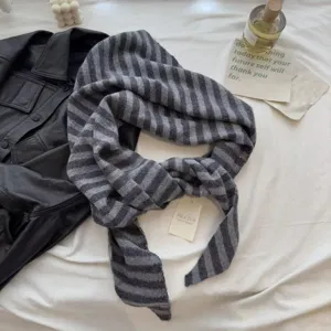 Grey striped knitted scarf for women, warm winter neckerchief, minimalist fashion accessory.