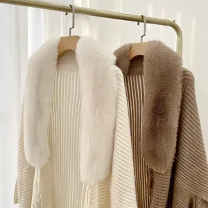 Women winter thick knitted cape cardigan with plush fur collar, stylish cozy outerwear.