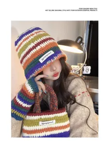 Close-up detail shot of colorful rainbow knit hat and matching handbag set for winter wear.