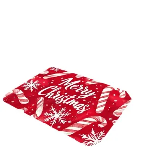 Festive red Christmas doormat featuring snowflakes, candy canes and Merry Christmas text