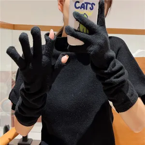 Gants tricotés noirs sans doigts pour femmes, longs chauffe-bras, accessoire d'hiver confortable.