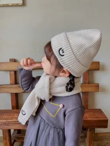 Kids winter knit hat and scarf set with cute smiley face embroidery, warm beanie for boys and girls.