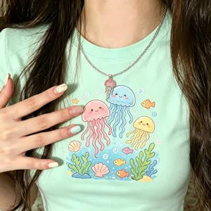 Close-up shot of the cute jellyfish pendant necklace and summer t-shirt print detail.