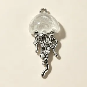 Detailed close-up shot of the exquisite jellyfish pendant, featuring a clear domed resin cap.