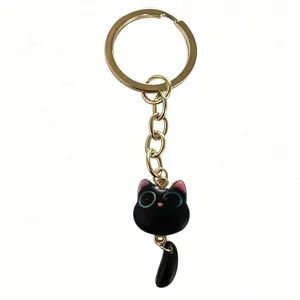 Cute black cat keychain with gold ring, metal chain and movable tail design charm accessory.