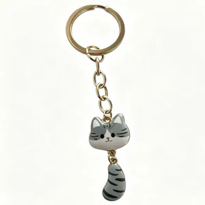 Cute grey cat metal keychain with movable tail, stylish anime style cartoon bag charm pendant.